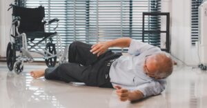 A resident falls from his wheelchair due to inadequate nursing home staffing.