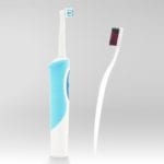 An electric toothbrush and a regular toothbrush