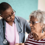 Nurse cares for elderly woman