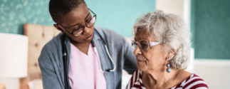 Nurse cares for elderly woman