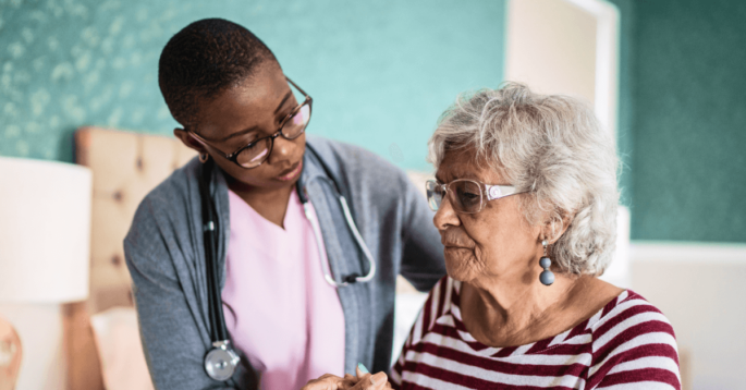 Nurse cares for elderly woman