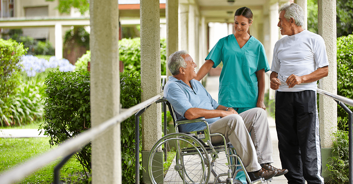 2 senior citizens at nursing home with nurse
