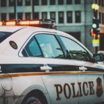 a police car outside of a building