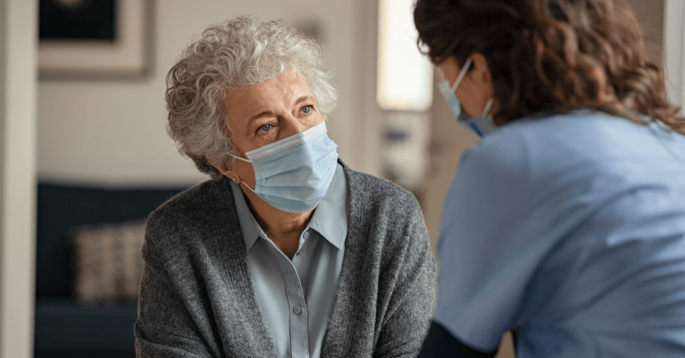 Resident talks with nursing home staff